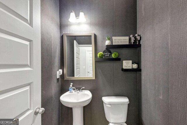 139 Coldwater Ln, Griffin, GA 30224 - bathroom with toilet and a sink