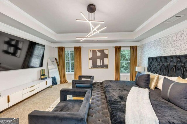139 Coldwater Ln, Griffin, GA 30224 - carpeted bedroom featuring a raised ceiling, a chandelier, and ornamental molding