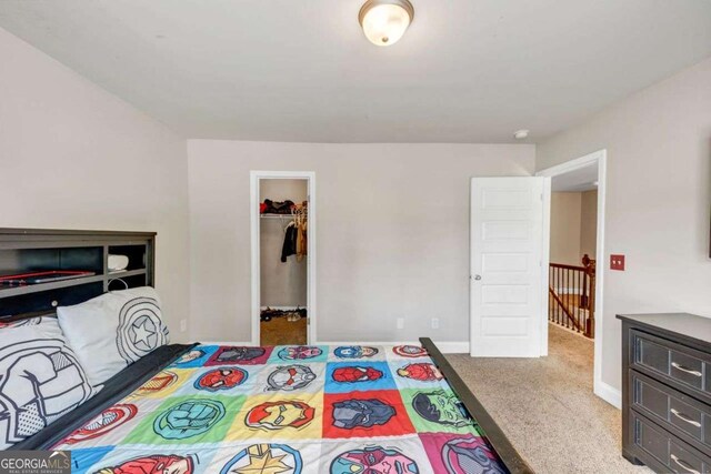 139 Coldwater Ln, Griffin, GA 30224 - bedroom with carpet flooring, a walk in closet, and a closet