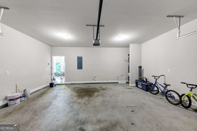 139 Coldwater Ln, Griffin, GA 30224 - garage featuring electric panel and a garage door opener