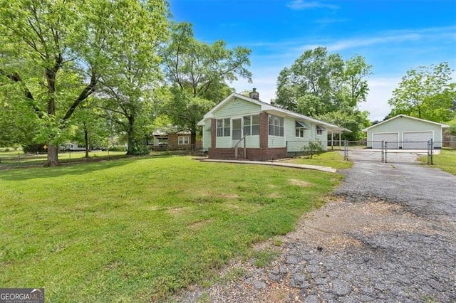 view of front of house with a garage, an outdoor structure, a chimney, and a gate