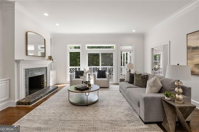 1260 Heards Ferry Rd, Sandy Springs, GA 30328 - living area featuring wood finished floors, crown molding, recessed lighting, a fireplace, and french doors