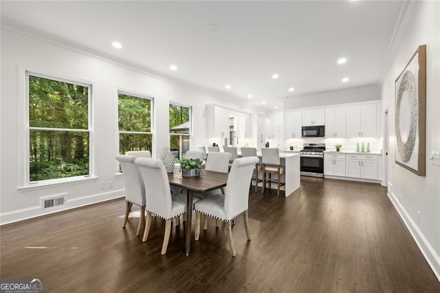 1260 Heards Ferry Rd, Sandy Springs, GA 30328 - dining space featuring crown molding, dark wood-style flooring, and recessed lighting