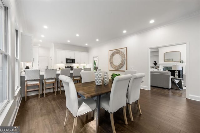 1260 Heards Ferry Rd, Sandy Springs, GA 30328 - dining room featuring ornamental molding, dark wood-type flooring, recessed lighting, and a fireplace