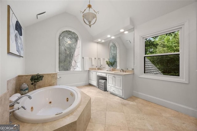 1260 Heards Ferry Rd, Sandy Springs, GA 30328 - bathroom featuring lofted ceiling, double vanity, a whirlpool tub, tile patterned floors, and baseboards