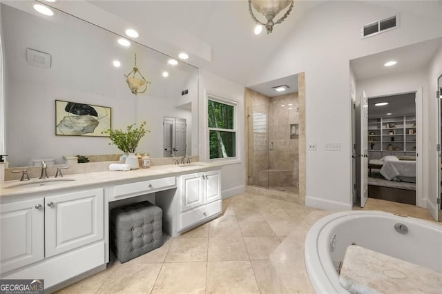 1260 Heards Ferry Rd, Sandy Springs, GA 30328 - ensuite bathroom featuring a shower stall, double vanity, tile patterned flooring, a garden tub, and baseboards