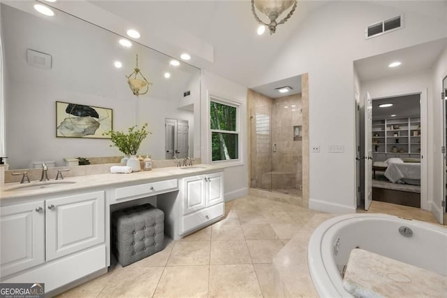 1260 Heards Ferry Rd, Sandy Springs, GA 30328 - full bath with double vanity, a stall shower, a garden tub, tile patterned flooring, and recessed lighting