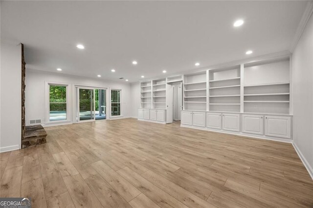 1260 Heards Ferry Rd, Sandy Springs, GA 30328 - unfurnished living room featuring light wood-style floors, baseboards, recessed lighting, and built in shelves