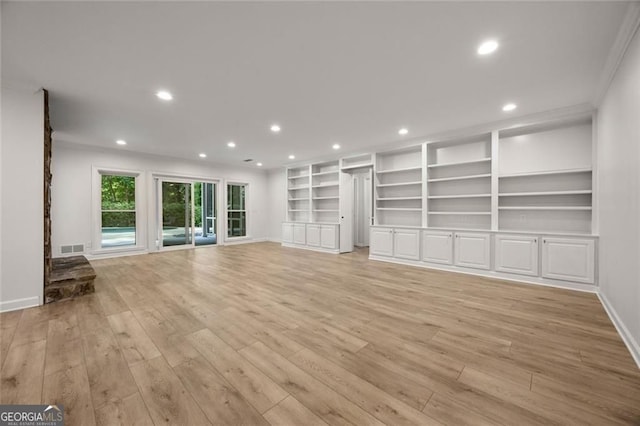 1260 Heards Ferry Rd, Sandy Springs, GA 30328 - unfurnished living room with light wood finished floors, recessed lighting, and built in shelves