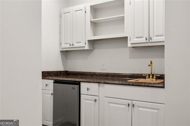 1260 Heards Ferry Rd, Sandy Springs, GA 30328 - kitchen with white cabinetry, open shelves, refrigerator, and dark stone counters