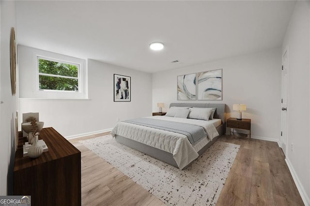 1260 Heards Ferry Rd, Sandy Springs, GA 30328 - bedroom featuring wood finished floors and baseboards