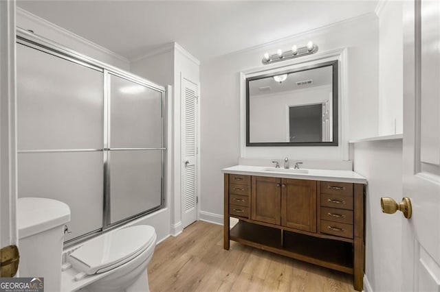 1260 Heards Ferry Rd, Sandy Springs, GA 30328 - bathroom featuring toilet, crown molding, wood finished floors, vanity, and baseboards