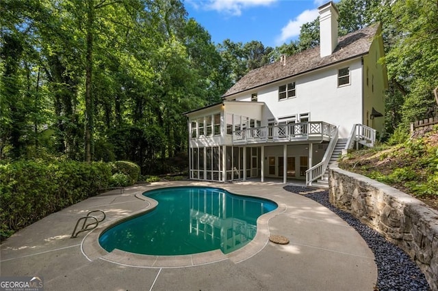 1260 Heards Ferry Rd, Sandy Springs, GA 30328 - outdoor pool with stairway, a sunroom, a patio, and a wooden deck