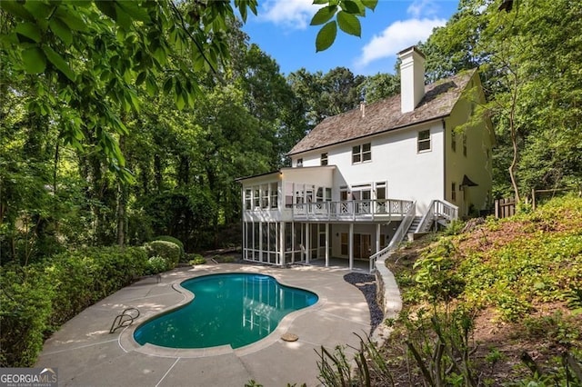 1260 Heards Ferry Rd, Sandy Springs, GA 30328 - outdoor pool featuring stairs, a deck, a patio area, a sunroom, and view of scattered trees