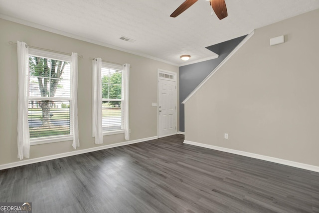 556 Poplar Bnd, Canton, GA 30114 - unfurnished living room with ceiling fan, dark wood-type flooring, baseboards, and crown molding