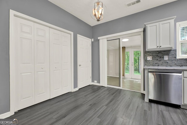 556 Poplar Bnd, Canton, GA 30114 - kitchen with dishwasher, wood finished floors, french doors, light countertops, and baseboards