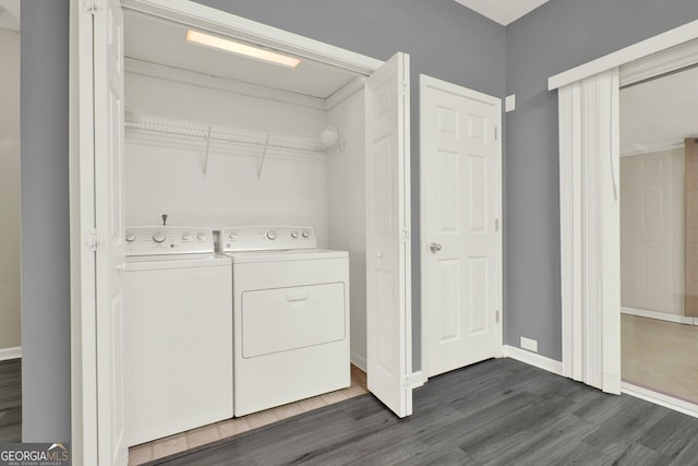 556 Poplar Bnd, Canton, GA 30114 - laundry room with washer and dryer, dark wood-style flooring, and baseboards