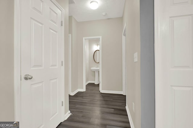 556 Poplar Bnd, Canton, GA 30114 - hallway featuring baseboards and dark wood-style flooring