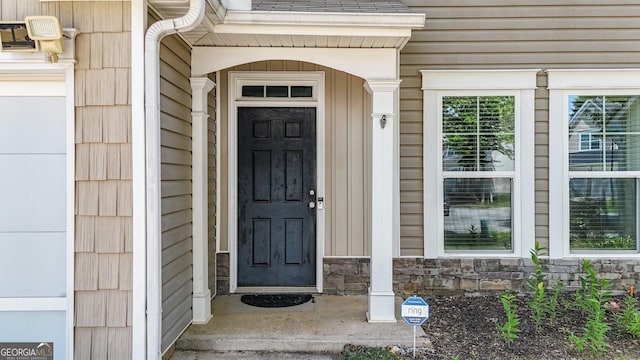 556 Poplar Bnd, Canton, GA 30114 - doorway to property featuring stone siding