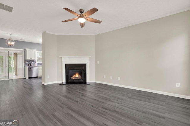 556 Poplar Bnd, Canton, GA 30114 - unfurnished living room with dark wood-style floors, a ceiling fan, a warm lit fireplace, baseboards, and ornamental molding