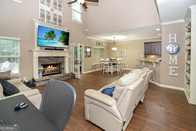 121 Hidden Springs Dr, Lagrange, GA 30240 - living area with a high ceiling, crown molding, ceiling fan, healthy amount of natural light, and a fireplace
