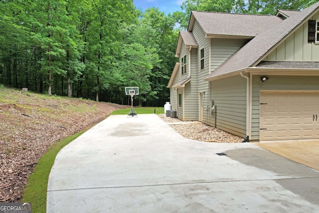 121 Hidden Springs Dr, Lagrange, GA 30240 - view of side of property featuring board and batten siding, a shingled roof, and concrete driveway