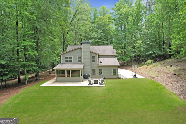 121 Hidden Springs Dr, Lagrange, GA 30240 - back of property with a patio, roof with shingles, a chimney, a yard, and a sunroom