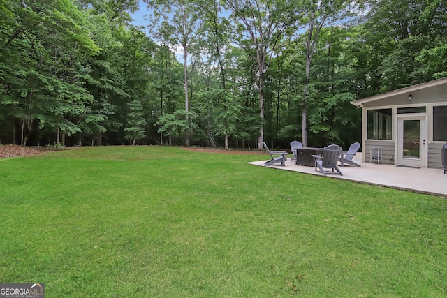 121 Hidden Springs Dr, Lagrange, GA 30240 - view of grassy yard with a patio area and an outdoor fire pit