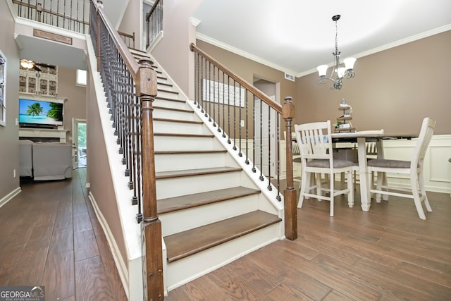 121 Hidden Springs Dr, Lagrange, GA 30240 - stairway with a chandelier, wood-type flooring, ornamental molding, and baseboards