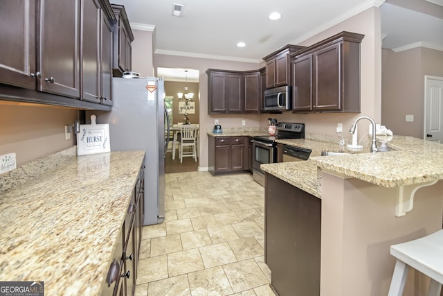 121 Hidden Springs Dr, Lagrange, GA 30240 - kitchen with stainless steel appliances, a sink, a peninsula, dark brown cabinetry, and ornamental molding