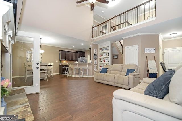 121 Hidden Springs Dr, Lagrange, GA 30240 - living area with ornamental molding, a towering ceiling, dark wood-type flooring, ceiling fan, and baseboards