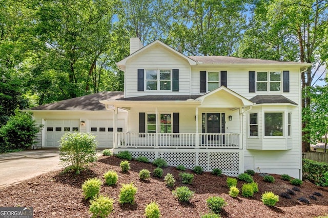 3078 Milford Chase SW, Marietta, GA 30008 - traditional-style house with covered porch, a garage, driveway, and a chimney