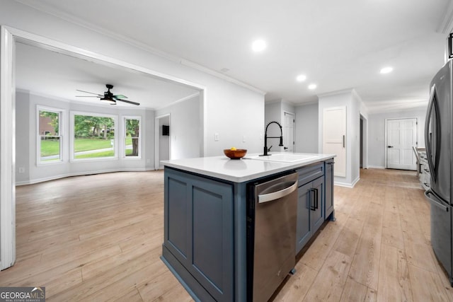 3078 Milford Chase SW, Marietta, GA 30008 - kitchen featuring stainless steel dishwasher, a sink, freestanding refrigerator, ornamental molding, and a center island with sink