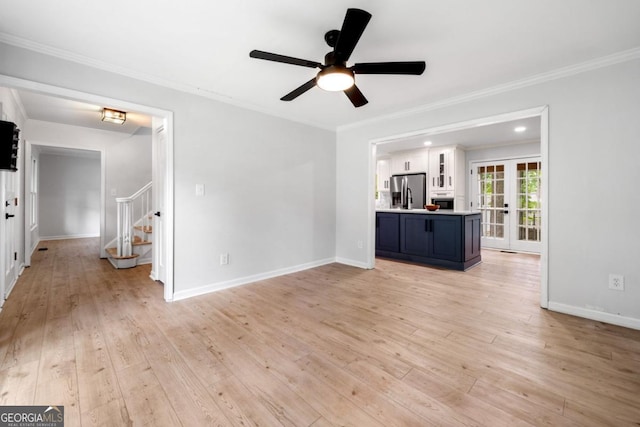 3078 Milford Chase SW, Marietta, GA 30008 - unfurnished living room featuring stairs, ceiling fan, light wood-type flooring, french doors, and baseboards