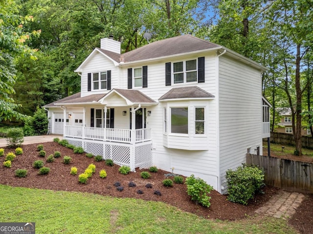 3078 Milford Chase SW, Marietta, GA 30008 - view of front of home with a porch, a chimney, concrete driveway, a garage, and roof with shingles