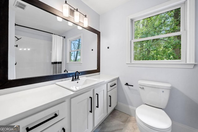 3078 Milford Chase SW, Marietta, GA 30008 - bathroom featuring baseboards, toilet, marble look tiles, and vanity