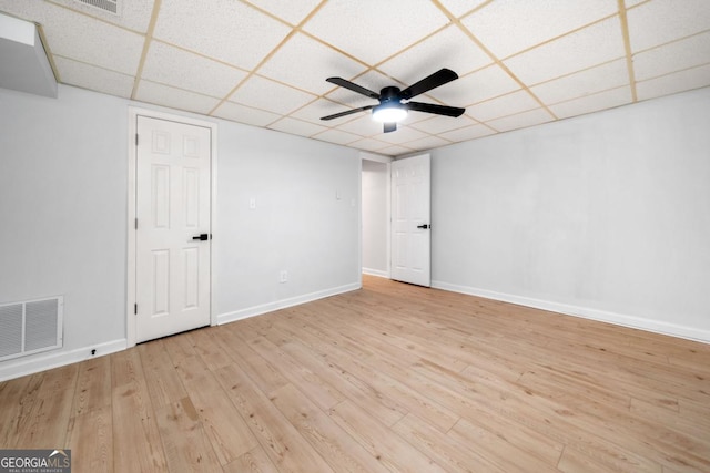 3078 Milford Chase SW, Marietta, GA 30008 - empty room with a drop ceiling, ceiling fan, wood finished floors, and baseboards