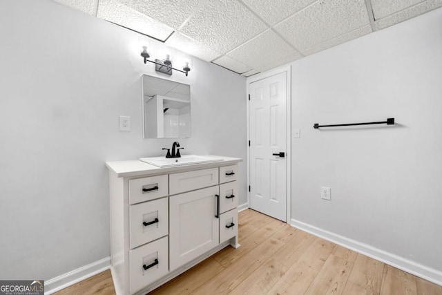 3078 Milford Chase SW, Marietta, GA 30008 - bathroom featuring a drop ceiling, baseboards, wood finished floors, and vanity