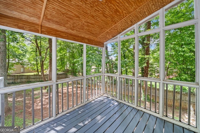 3078 Milford Chase SW, Marietta, GA 30008 - unfurnished sunroom with lofted ceiling and view of scattered trees