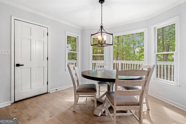 3078 Milford Chase SW, Marietta, GA 30008 - dining space featuring a chandelier, ornamental molding, light wood-style flooring, and baseboards