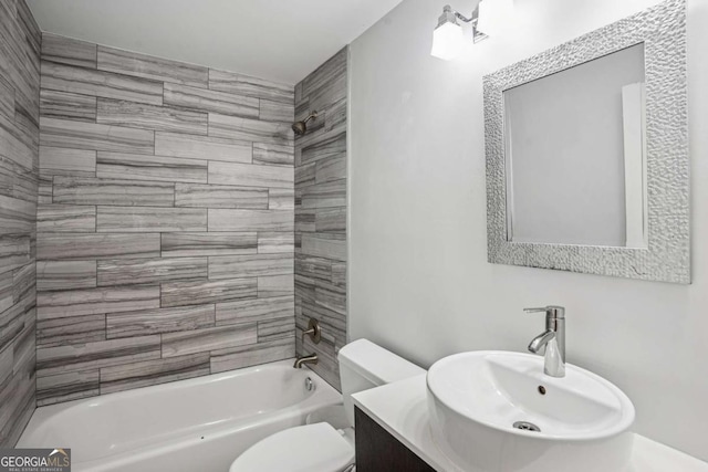 full bath featuring toilet, tub / shower combination, and vanity