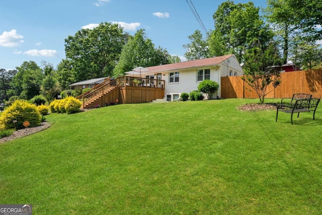 view of yard featuring stairs and a wooden deck
