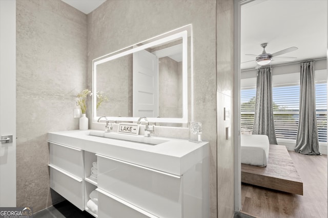2300 Harbersham Marina Rd Unit 102, Cumming, GA 30041 - bathroom with ceiling fan, wood finished floors, and vanity