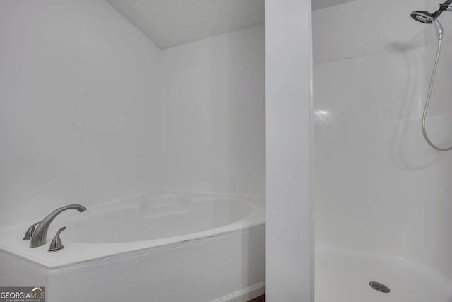 full bathroom featuring a shower and a bath