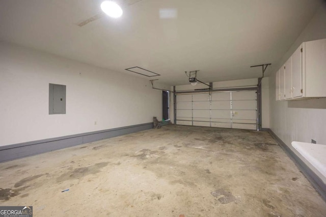 garage with electric panel and a garage door opener