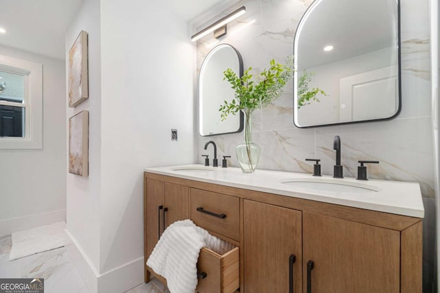 full bathroom with baseboards, double vanity, tasteful backsplash, recessed lighting, and marble finish flooring