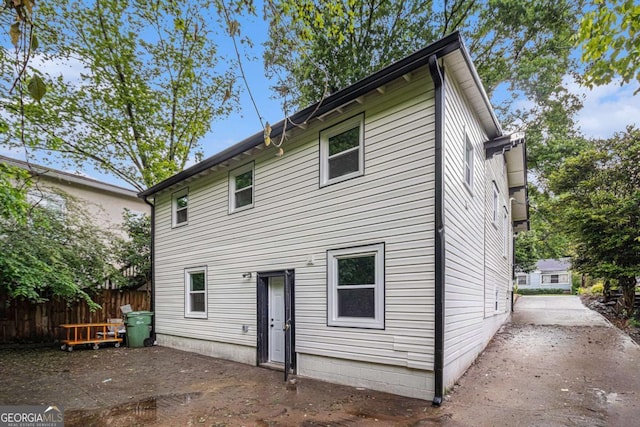 rear view of property with fence