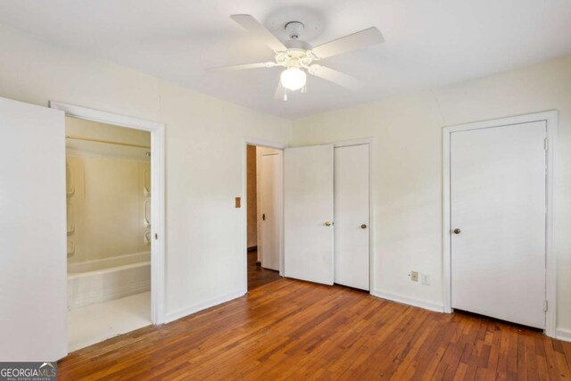 88 Karland Dr NW, Atlanta, GA 30305 - unfurnished bedroom featuring hardwood / wood-style floors, ensuite bath, baseboards, and ceiling fan