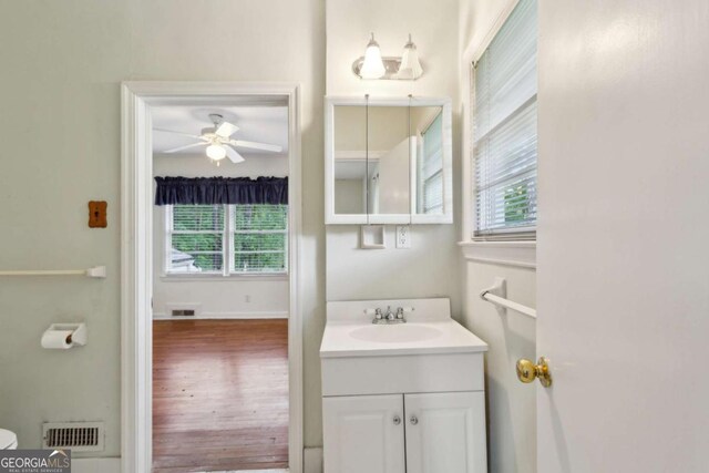 88 Karland Dr NW, Atlanta, GA 30305 - half bathroom with plenty of natural light, a ceiling fan, vanity, and wood finished floors