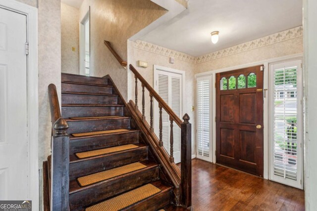 88 Karland Dr NW, Atlanta, GA 30305 - foyer entrance featuring wood finished floors, wallpapered walls, and stairway